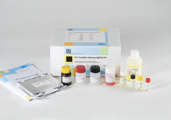 The components of the Immundiagnostik Candida Albicans IgM ELISA laid out in front of a white background.