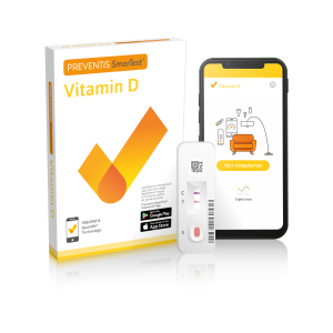 The Preventis SmarTest Pro® Vitamin D testing kit standing next to a smartphone running the app procedure.